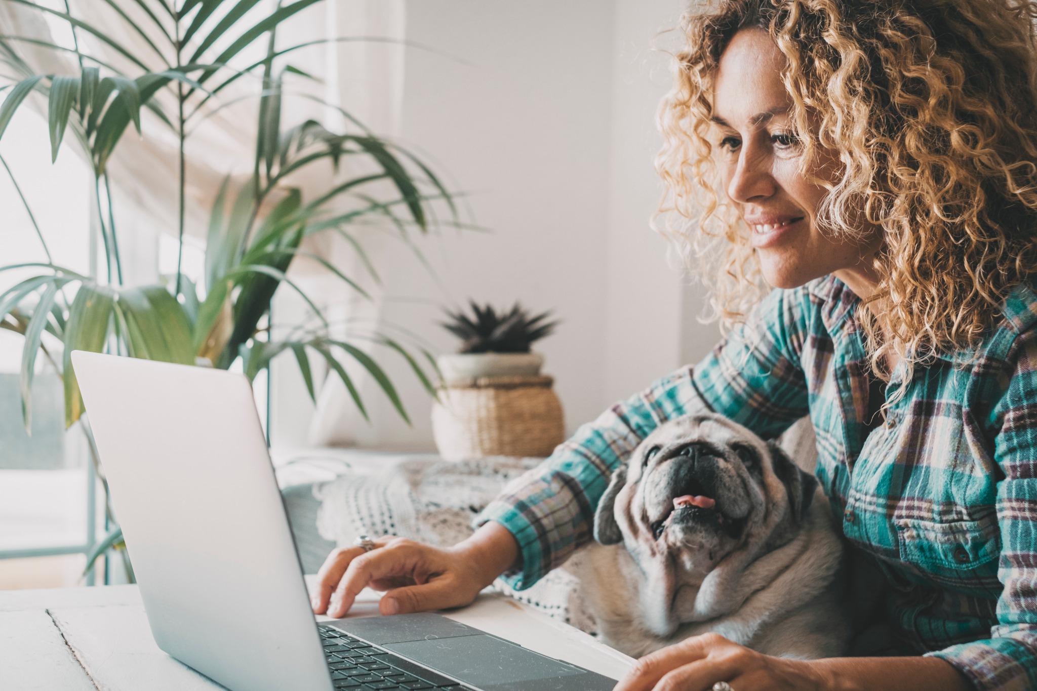 Woman and dog checking email